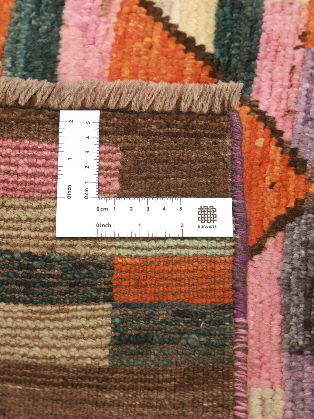 Hand-knotted Middle Eastern rug with a vibrant geometric pattern in multicolor Wool
