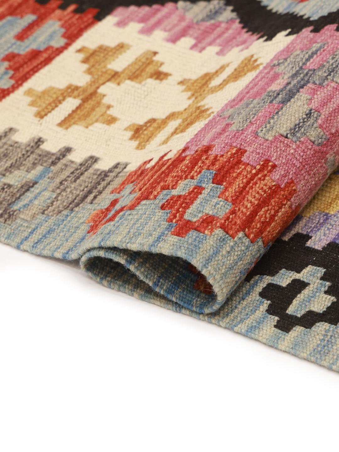 A vibrant, hand-woven Afghan Kelim rug featuring a bold diamond pattern in multicolor wool.