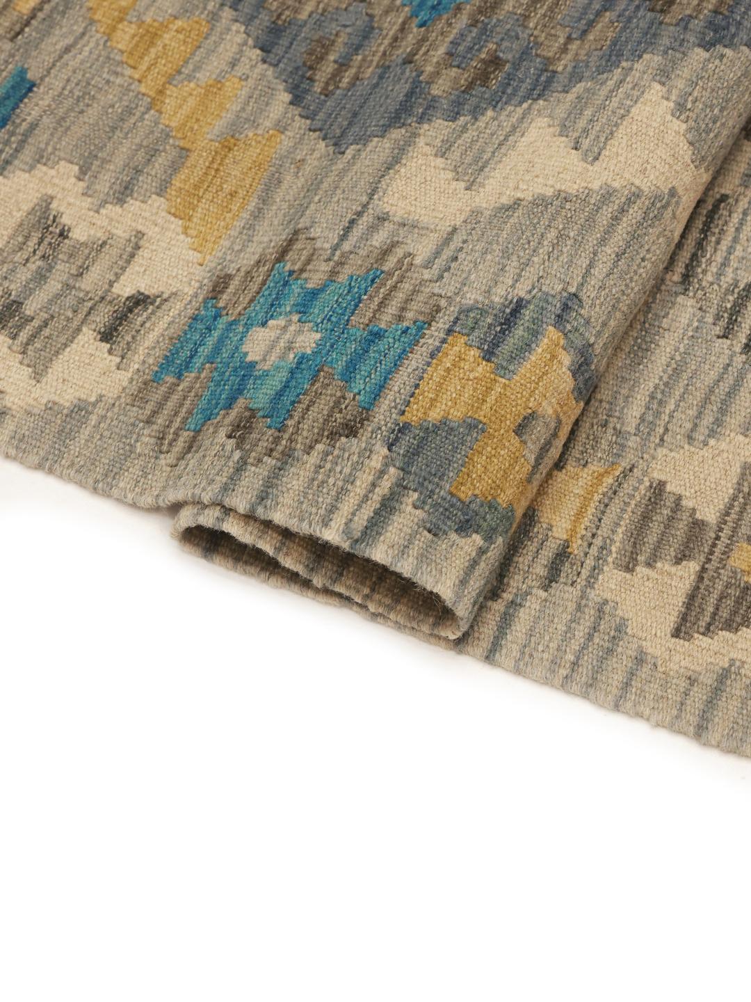 Hand-woven Afghan Kelim rug with geometric patterns in blue, beige, and grey