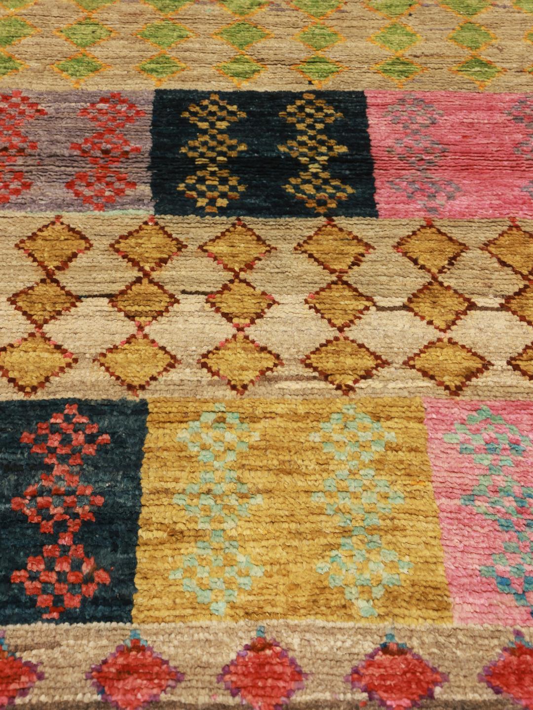 Hand-knotted Afghan rug with a colourful geometric patchwork design in multicolour Wool.