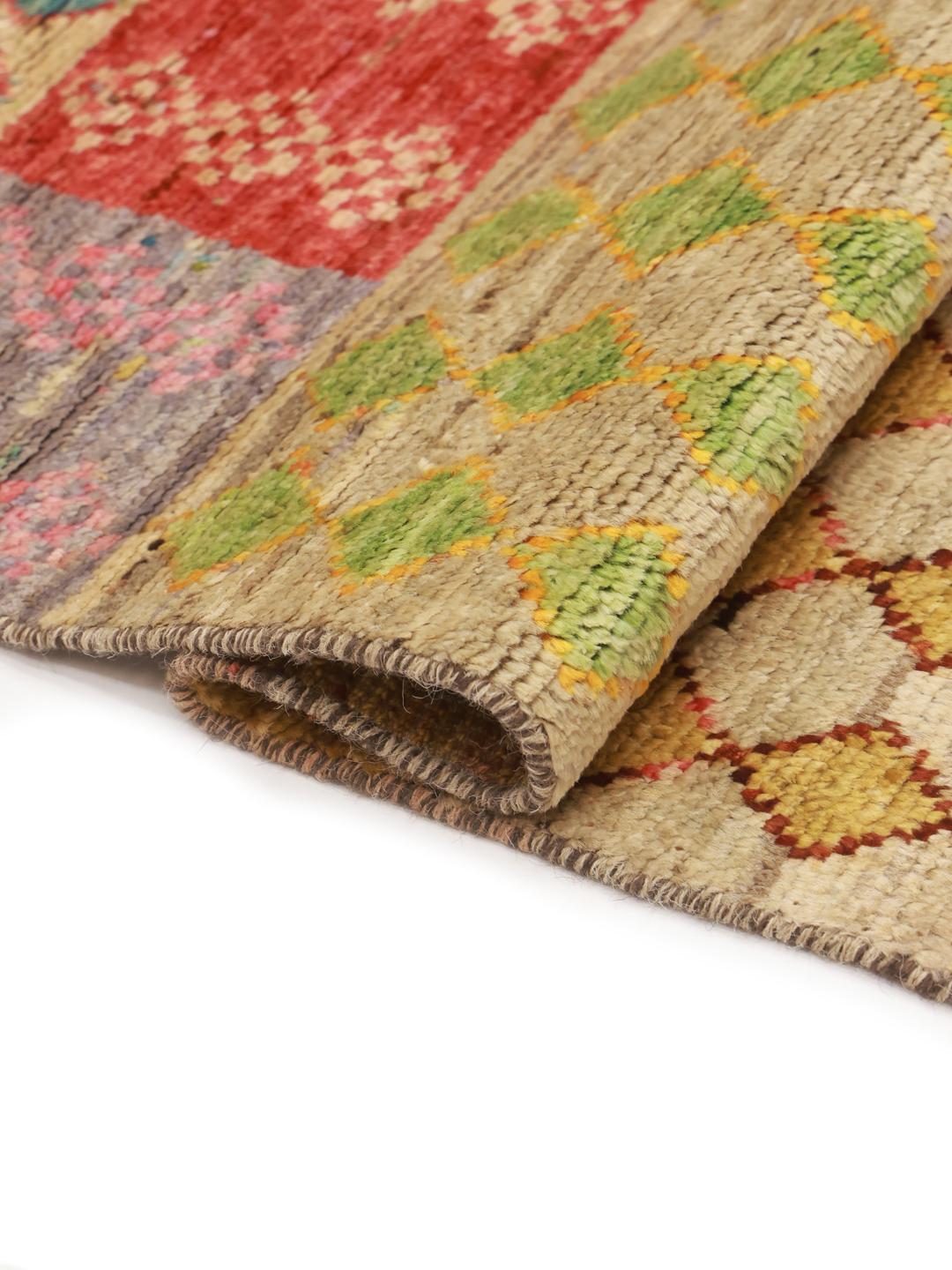 Hand-knotted Afghan rug with a colourful geometric patchwork design in multicolour Wool.