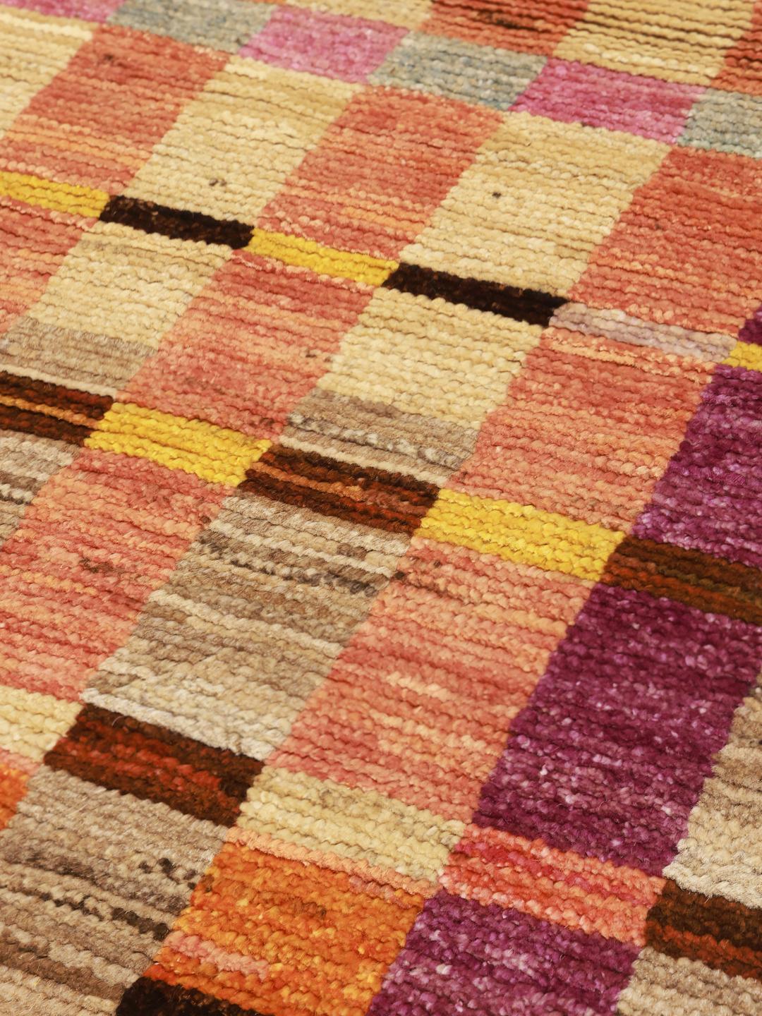 Hand-knotted Berber rug from Afghanistan with a vibrant multicolor geometric pattern