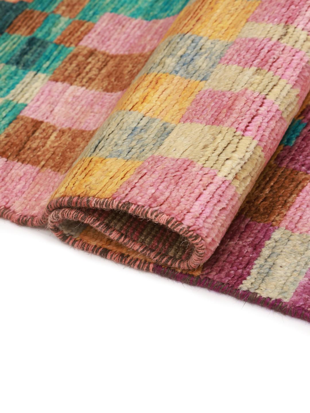 Hand-knotted Berber rug from Afghanistan with a vibrant multicolor geometric pattern