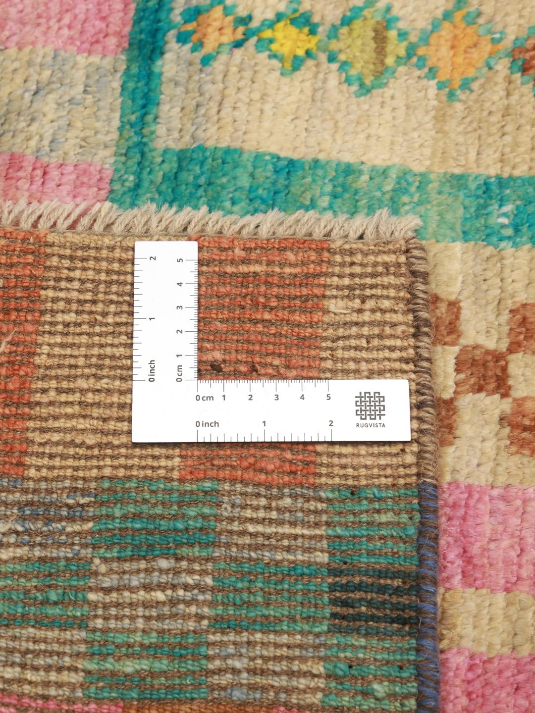 Hand-knotted Berber rug from Afghanistan with a vibrant multicolor geometric pattern