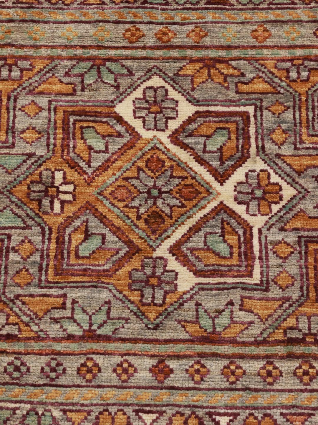 Tapis afghan noué à la main avec des motifs géométriques multicolores