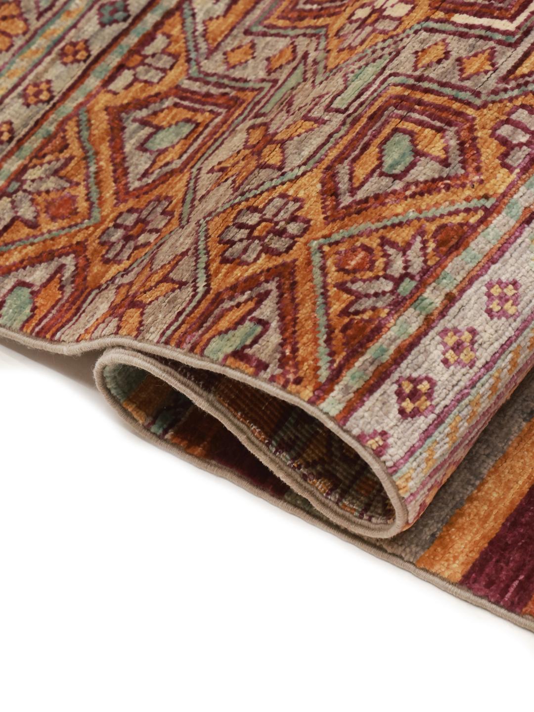 Tapis afghan noué à la main avec des motifs géométriques multicolores