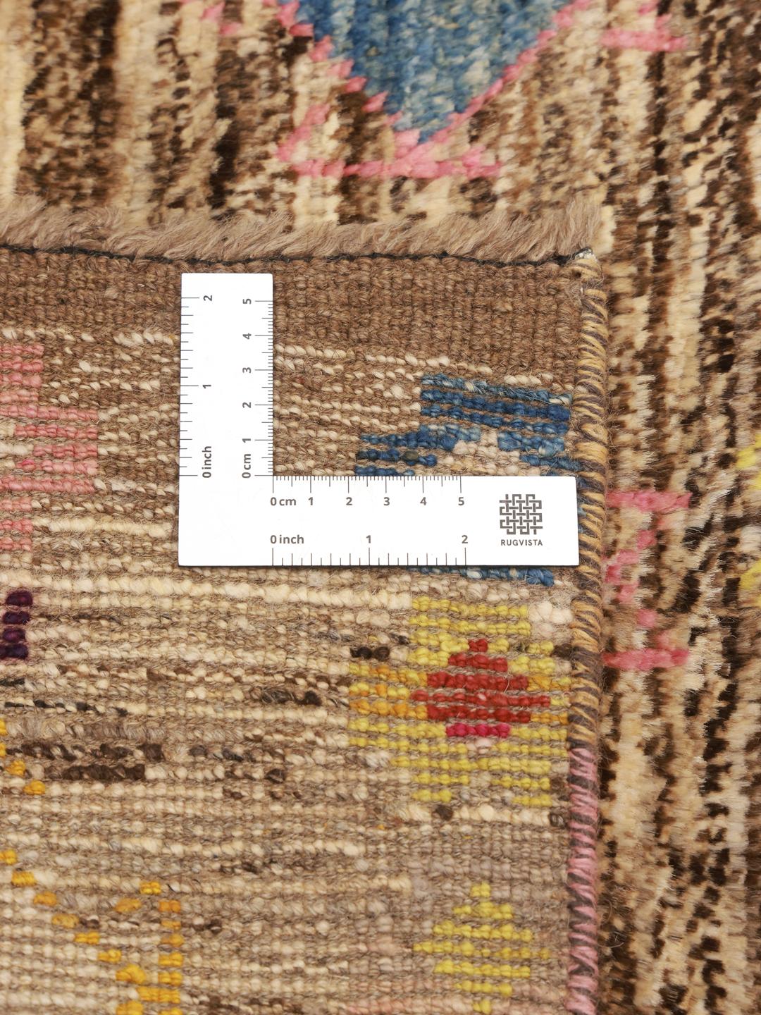 Hand-knotted Berber rug from Afghanistan with a multicolour diamond pattern on a brown background.