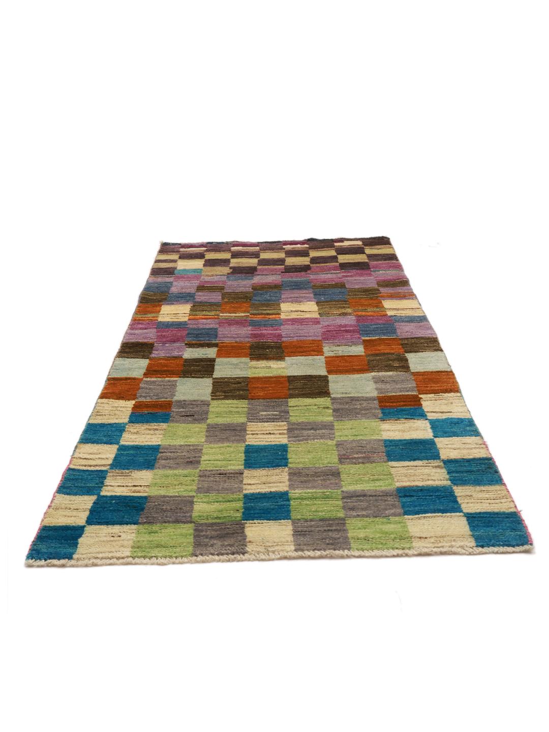 A vibrant, checkered hand-knotted wool runner rug from the Middle East in multicolor tones.
