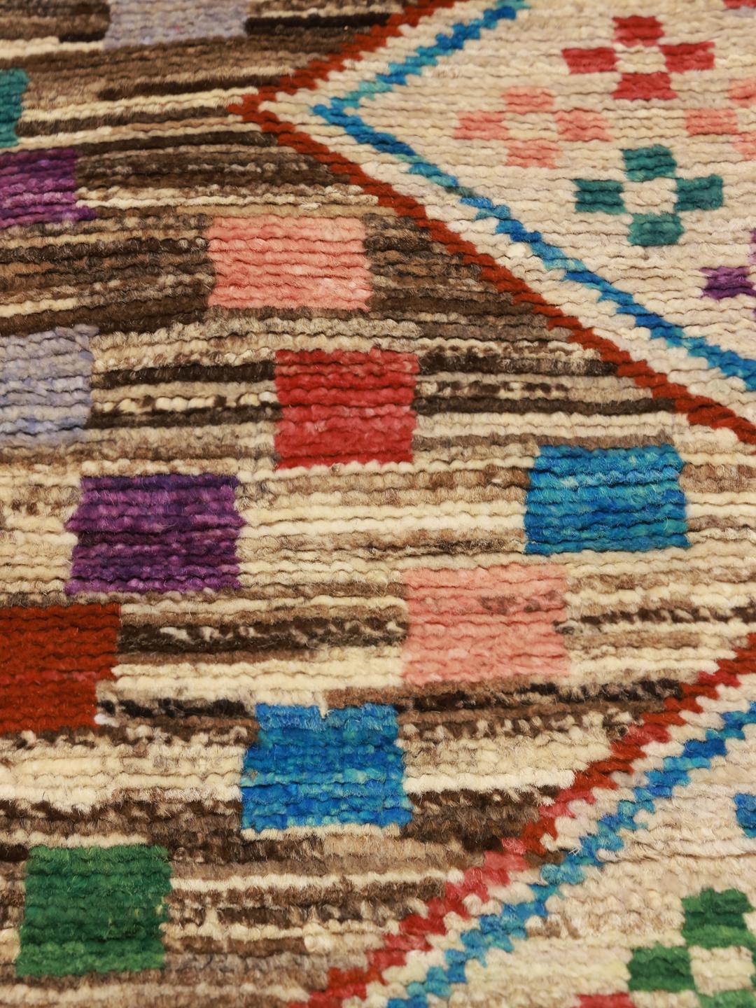 Hand-knotted Afghan rug featuring a colourful geometric mosaic pattern in multicolour wool.