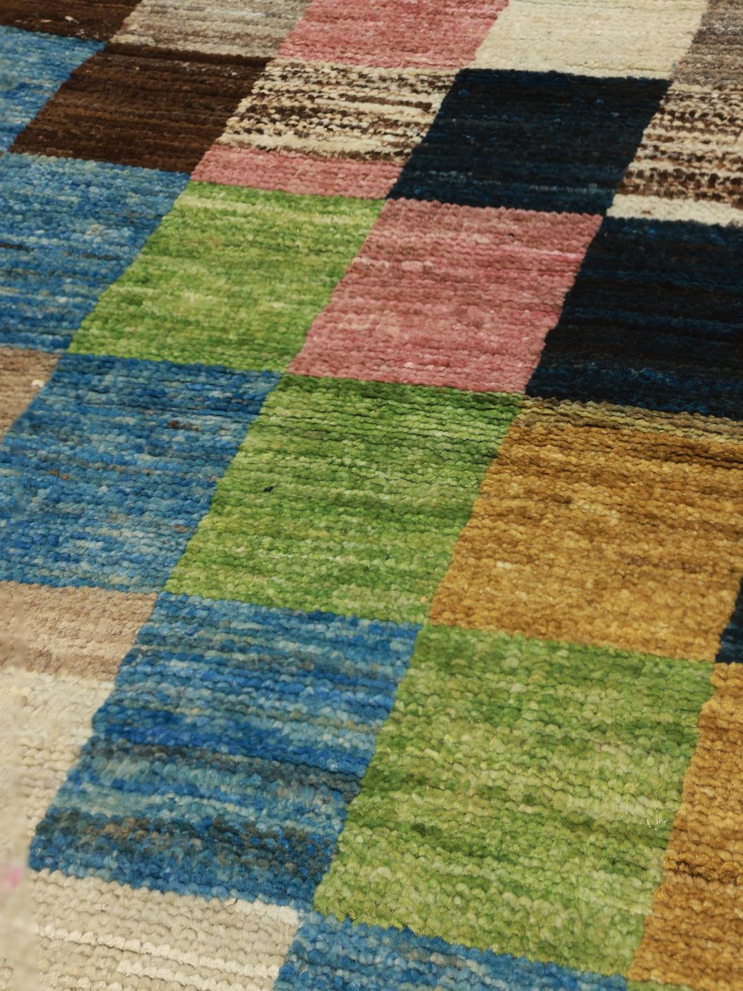 Hand-knotted multicolored Afghan runner with a vibrant patchwork pattern
