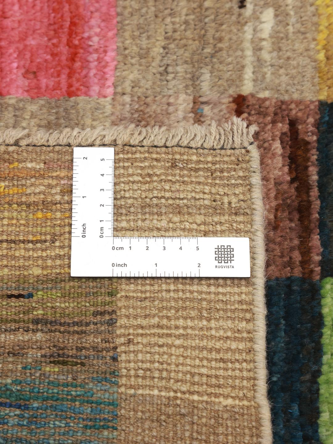 Hand-knotted multicolored Afghan runner with a vibrant patchwork pattern