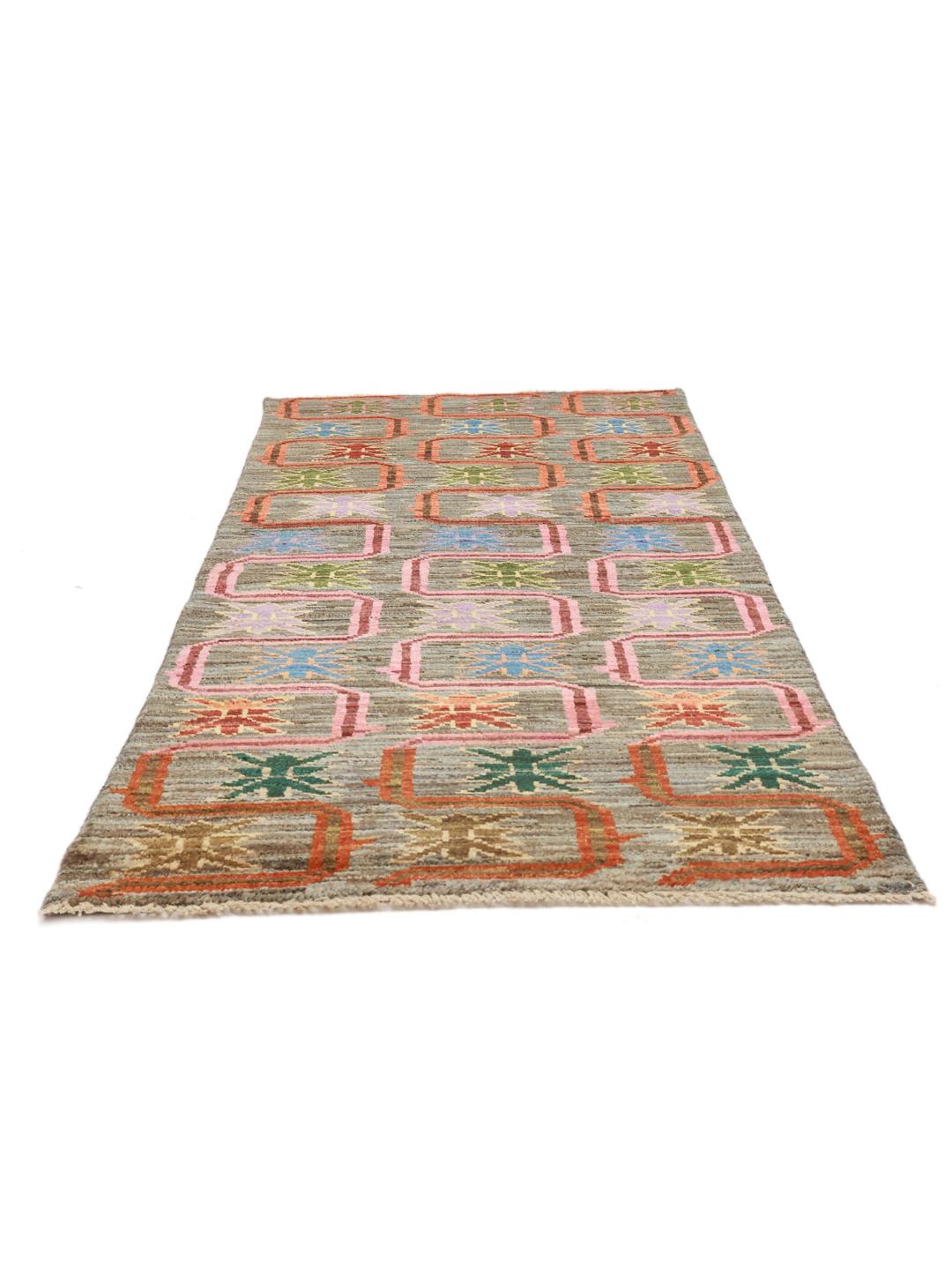 Hand-knotted Middle Eastern runner with a colourful pattern on a grey background