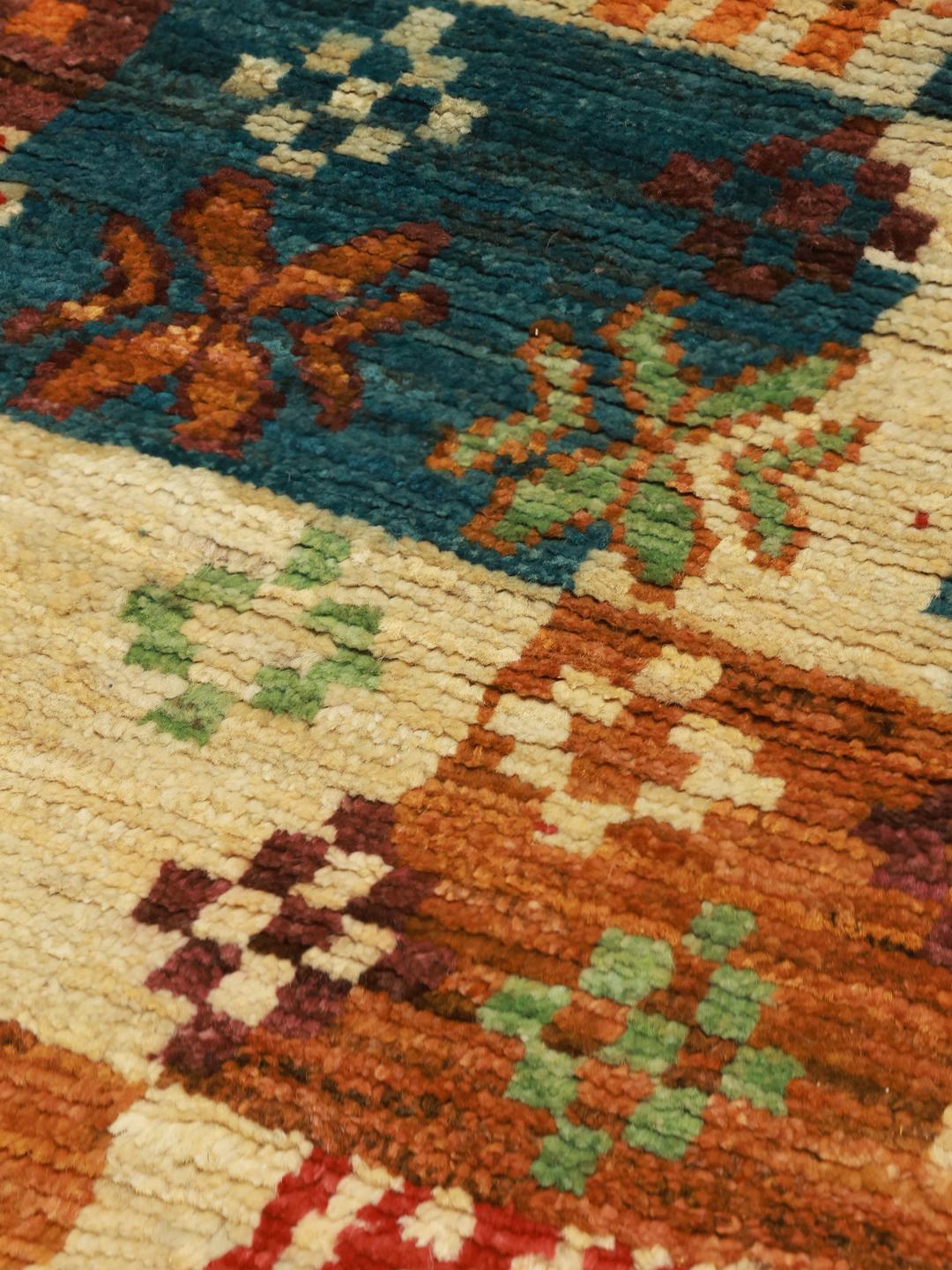 Hand-knotted Afghan runner with a vibrant, multicolor patchwork design