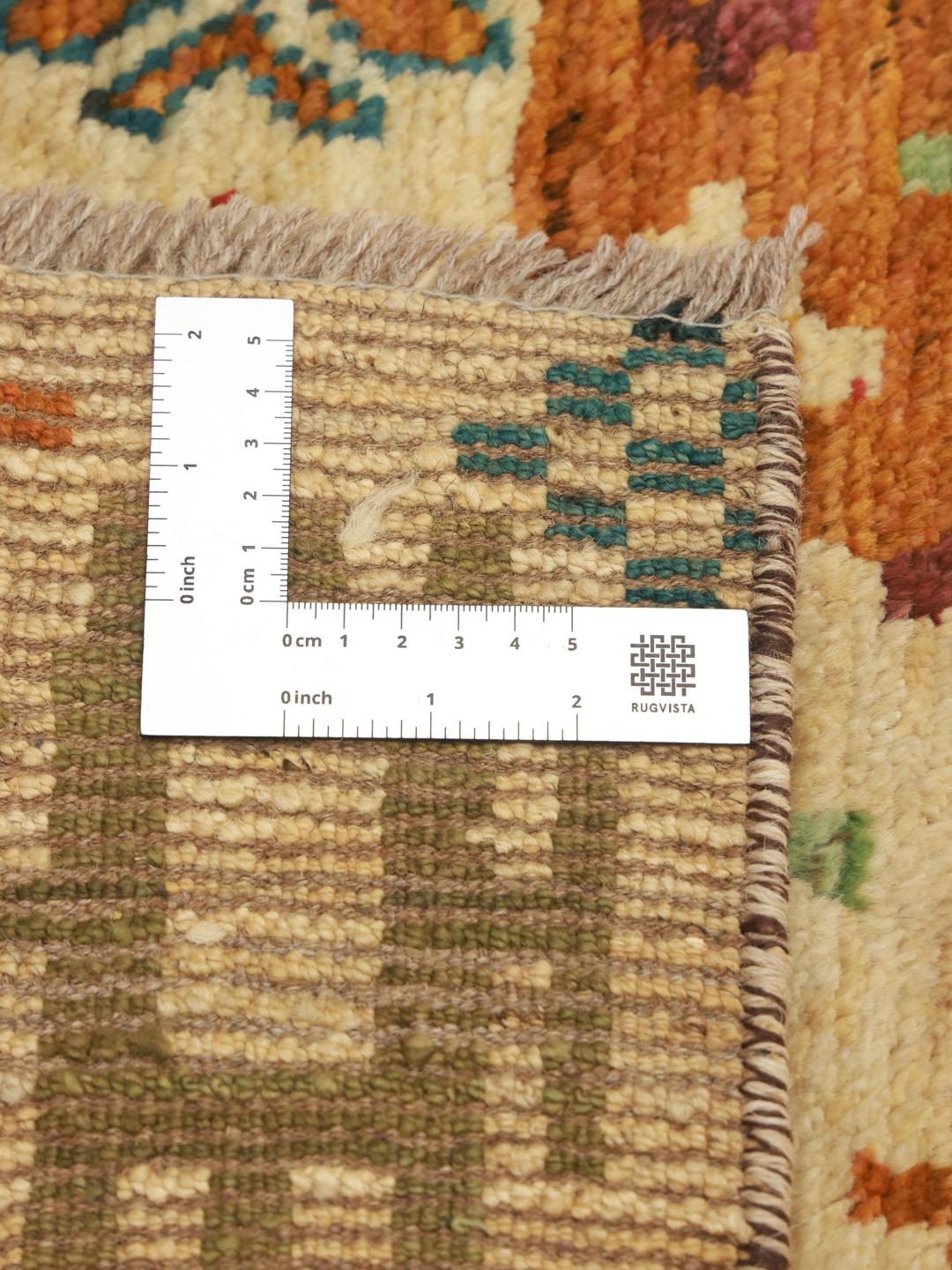 Hand-knotted Afghan runner with a vibrant, multicolor patchwork design
