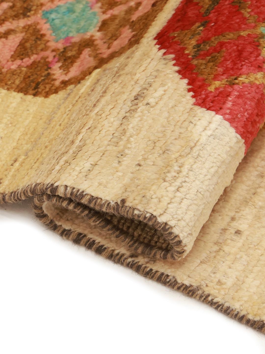 Hand-knotted Afghan Berber Colourful rug with vibrant geometric motifs on a beige background.