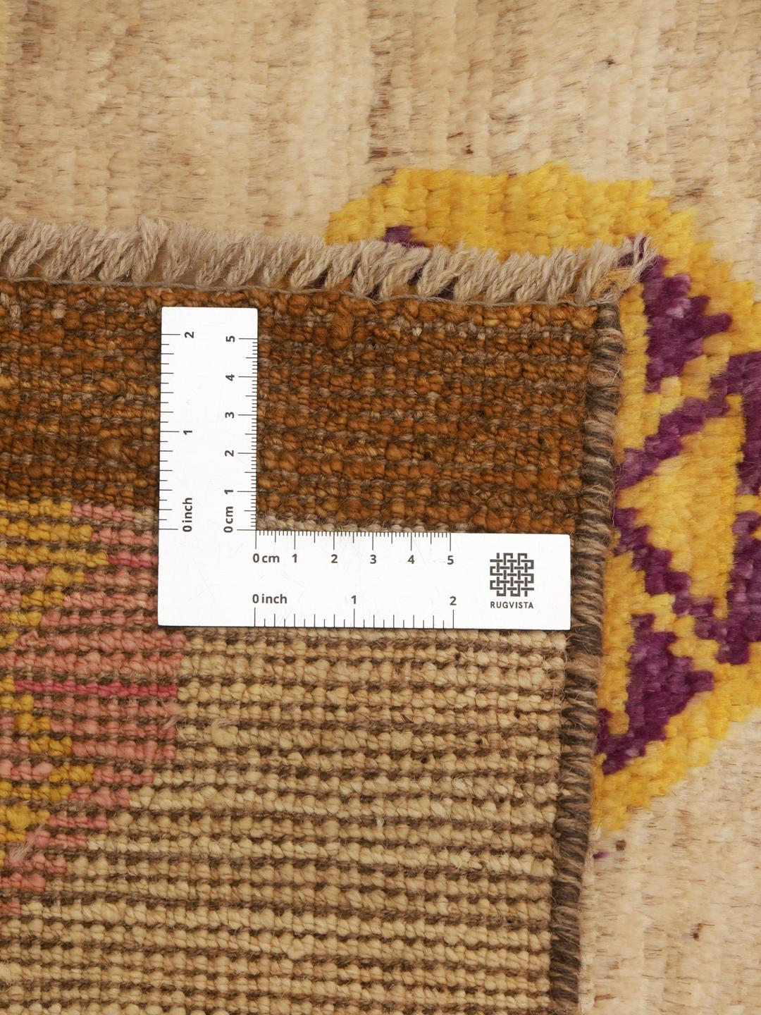 Hand-knotted Afghan Berber Colourful rug with vibrant geometric motifs on a beige background.