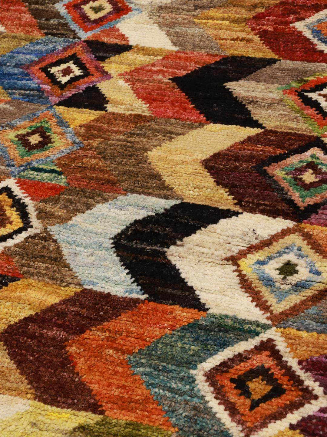 Hand-knotted Afghan Berber rug with a colourful geometric pattern in multicolour Wool.