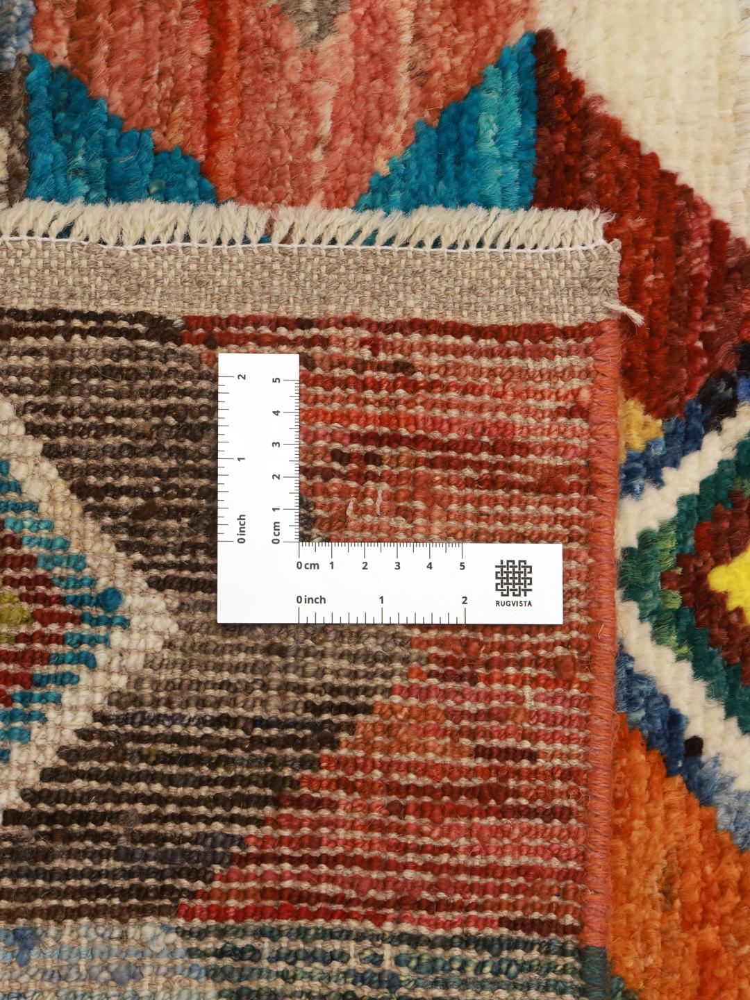 Hand-knotted Afghan Berber rug with a colourful geometric pattern in multicolour Wool.