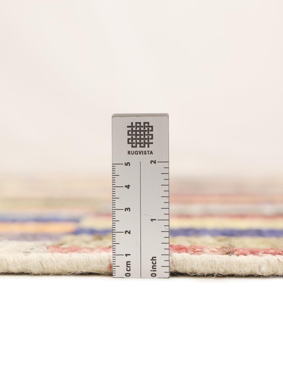 A vibrant, multi-coloured hand-knotted rug from Afghanistan with a block pattern.