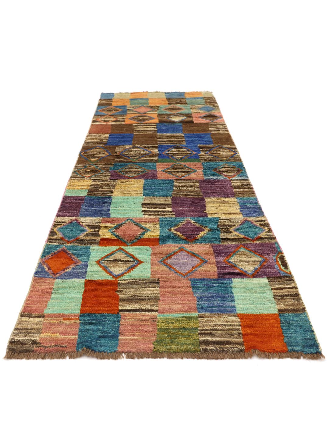 Håndknyttet løber med et farverigt geometrisk patchwork-mønster fra Afghanistan