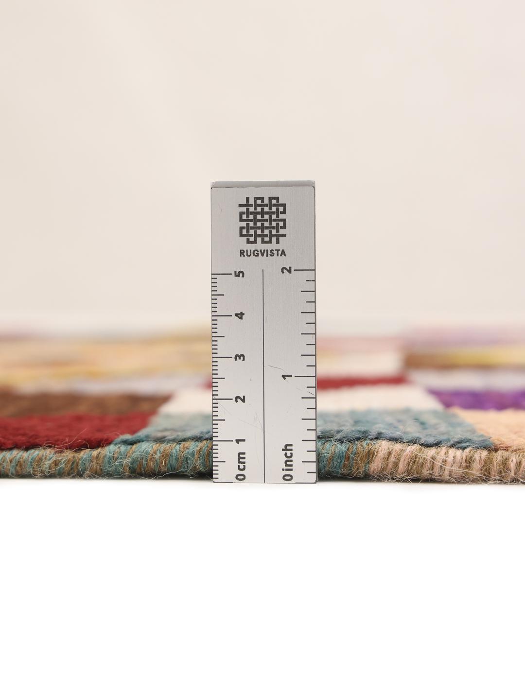 Hand-knotted Afghan runner with vibrant geometric diamond motifs and multicolor squares.