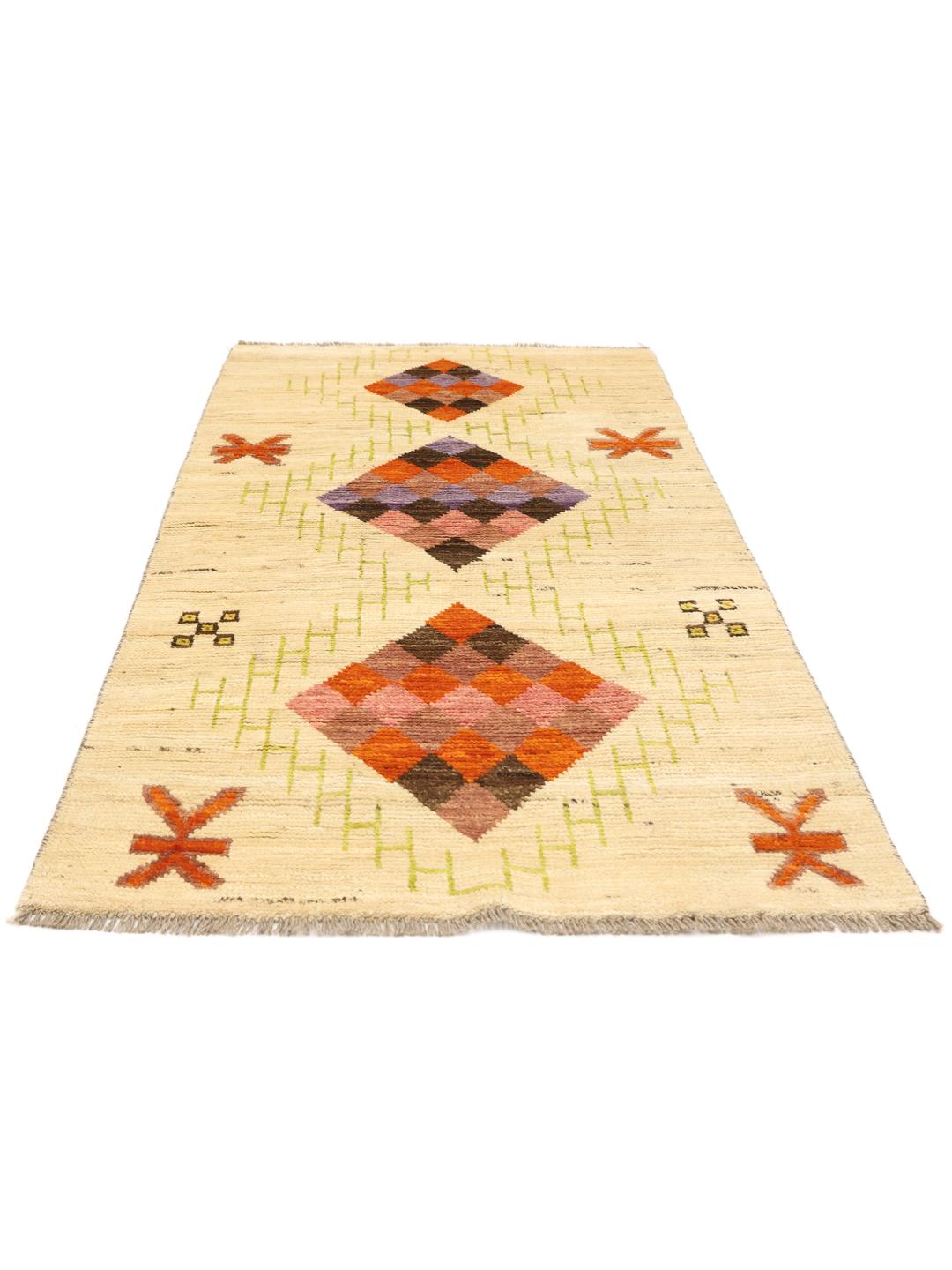Hand-knotted Afghan rug with colourful geometric diamonds on a beige background.