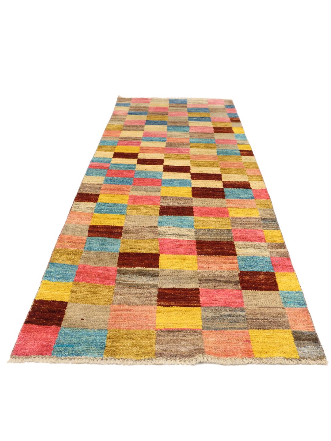 A colourful hand-knotted Afghan runner rug with a vibrant checkerboard pattern
