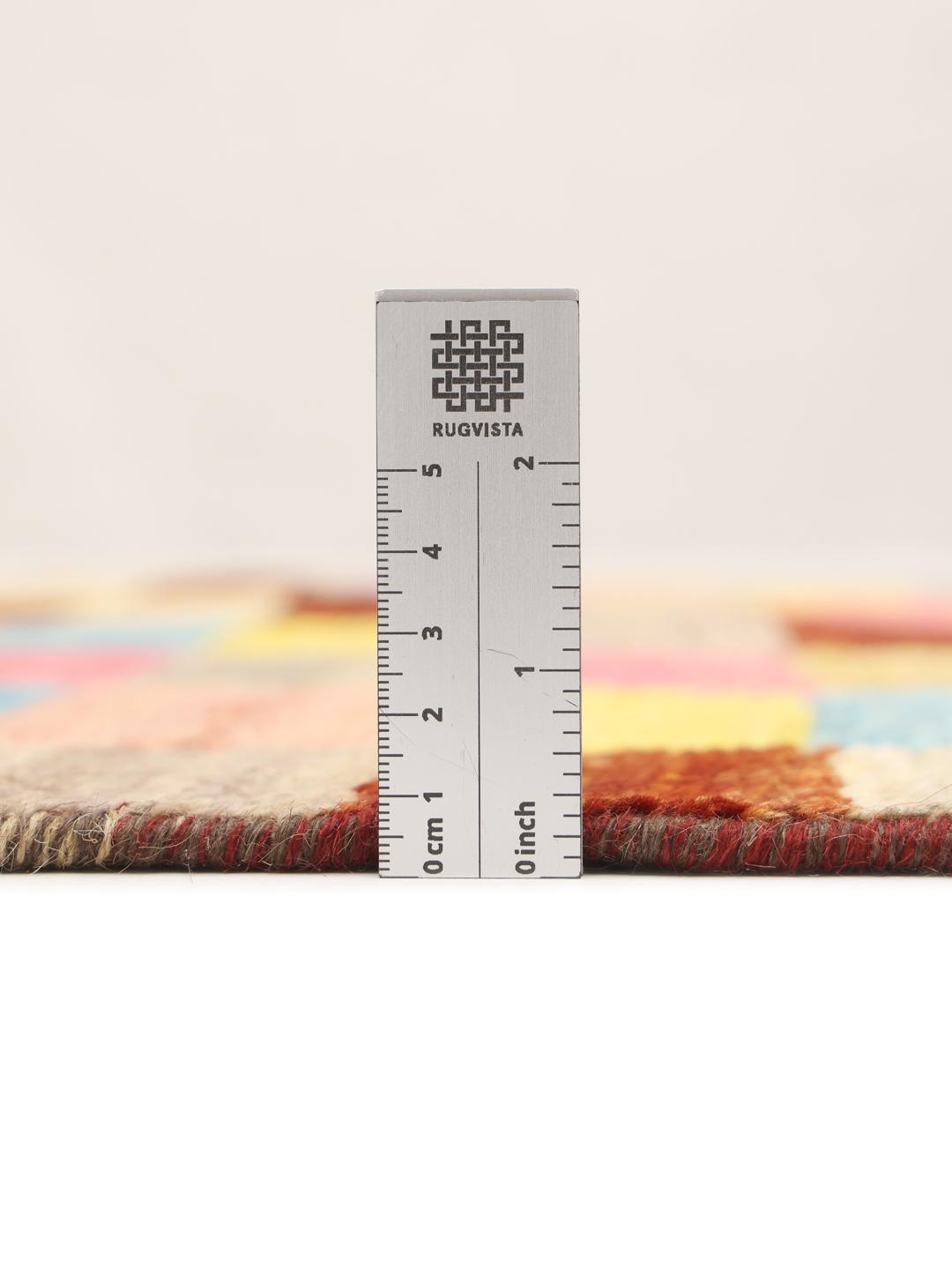 A colourful hand-knotted Afghan runner rug with a vibrant checkerboard pattern
