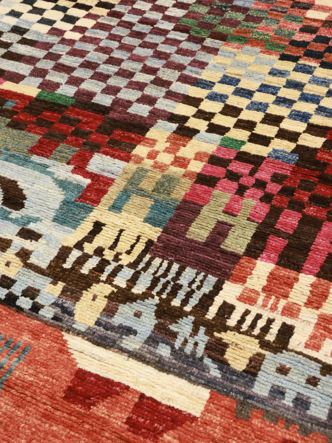 Hand-knotted Afghan rug with a colourful geometric pattern
