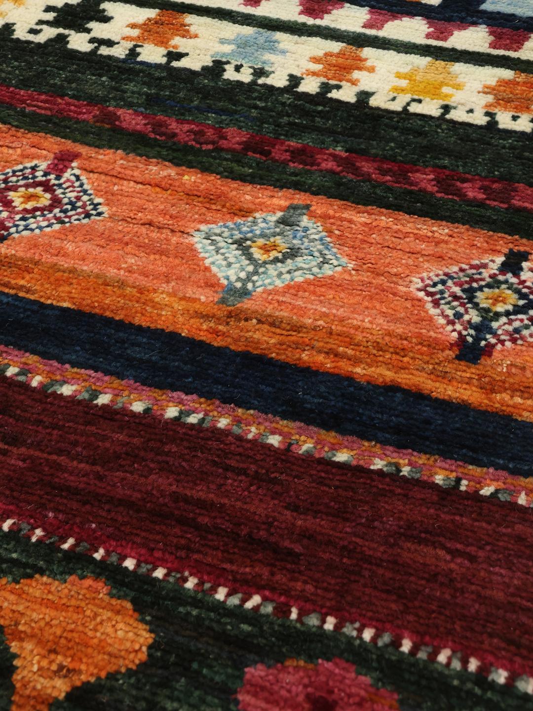 A hand-knotted Afghan Berber rug with a vibrant, multicolor geometric design.
