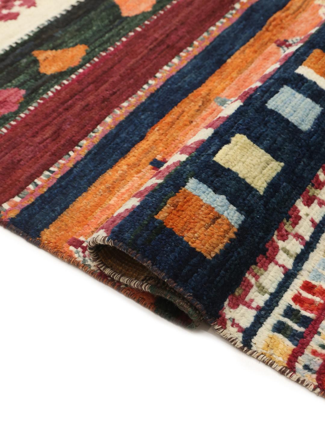 A hand-knotted Afghan Berber rug with a vibrant, multicolor geometric design.