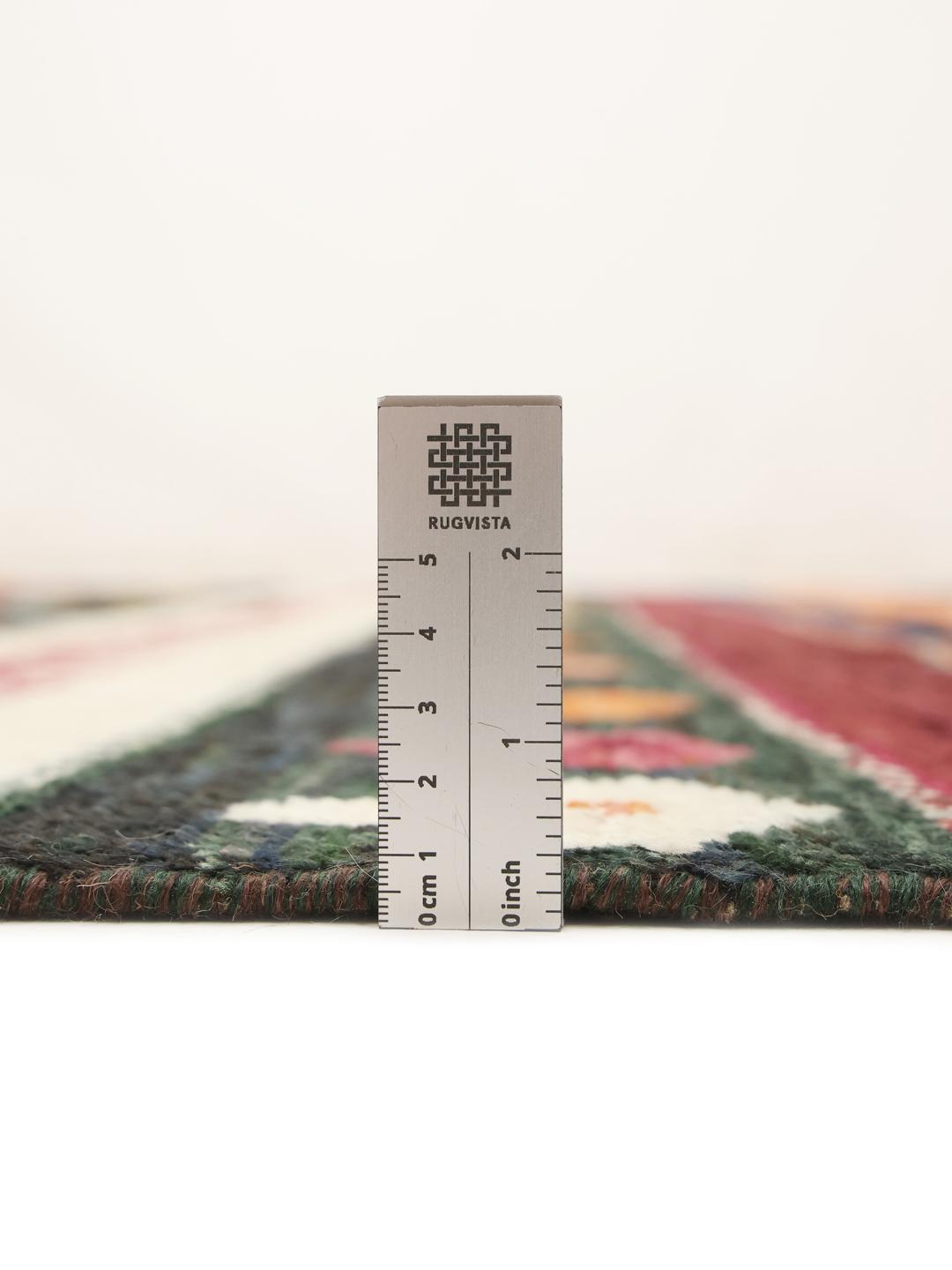 A hand-knotted Afghan Berber rug with a vibrant, multicolor geometric design.