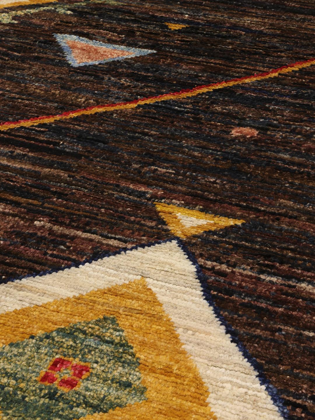 Hand-knotted Afghan Berber Colourful rug with a dark field and multicoloured geometric diamonds.