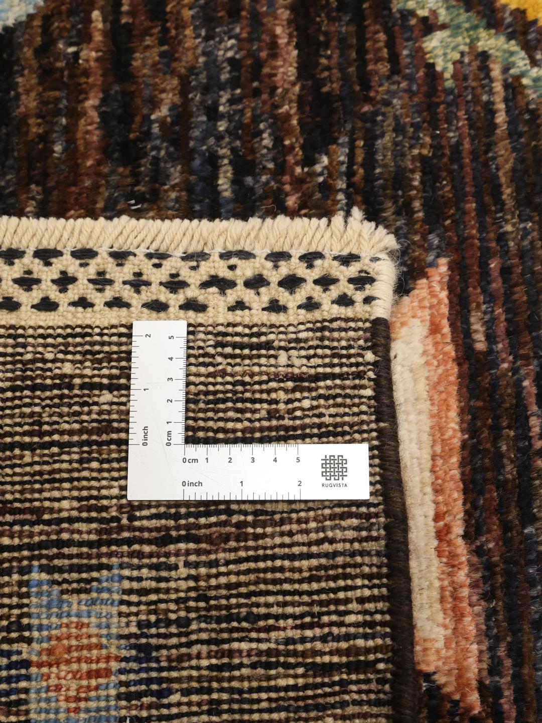 Hand-knotted Afghan Berber Colourful rug with a dark field and multicoloured geometric diamonds.