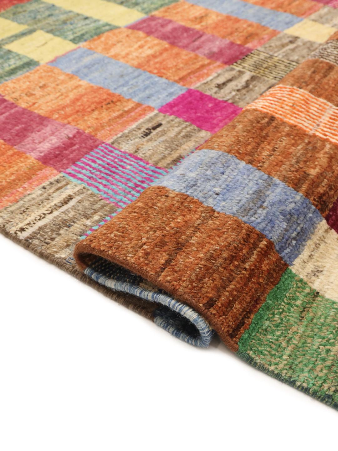 A vibrant, hand-knotted multicolor Berber-inspired rug from Afghanistan featuring a geometric grid design.