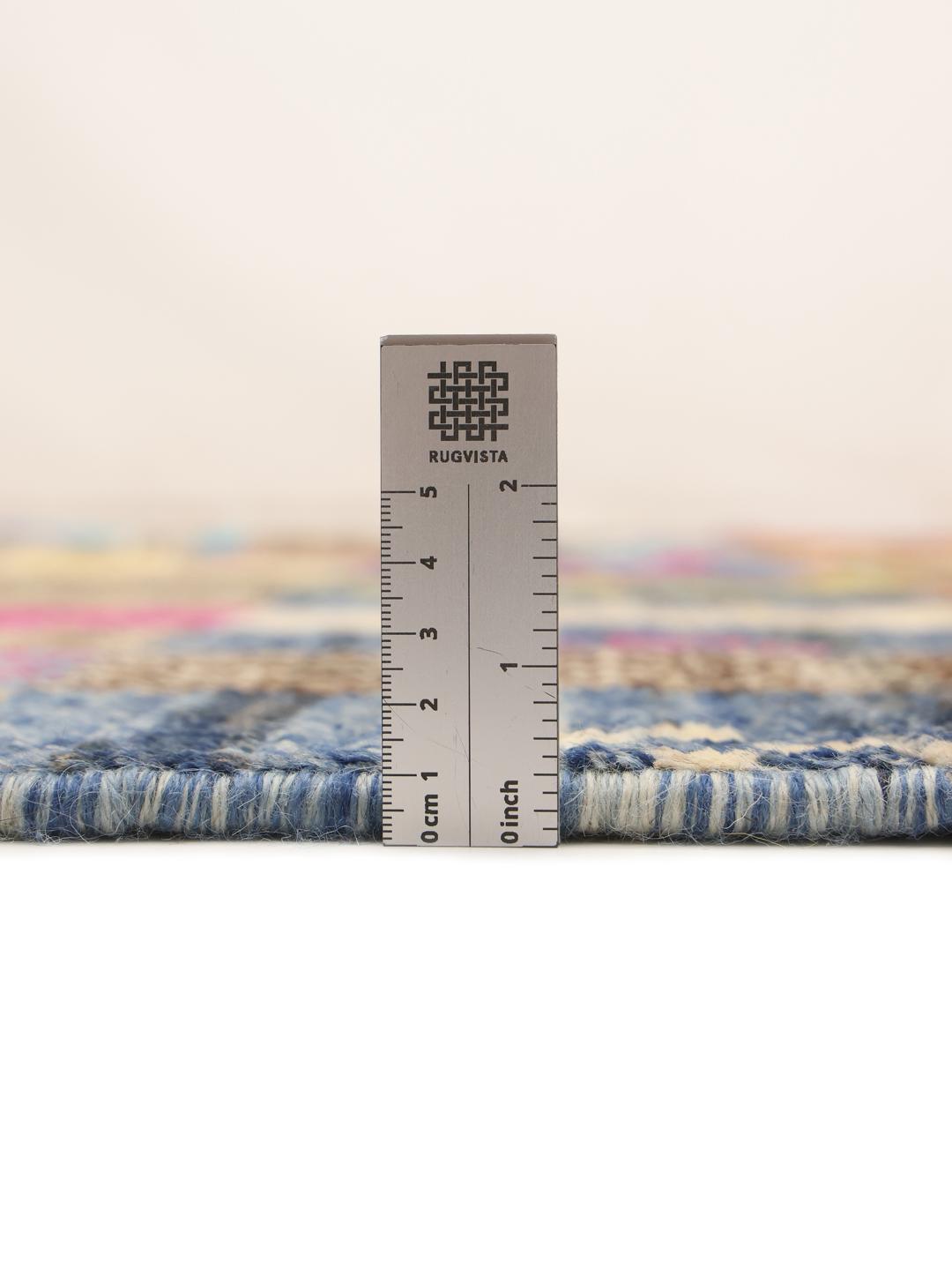 A vibrant, hand-knotted multicolor Berber-inspired rug from Afghanistan featuring a geometric grid design.