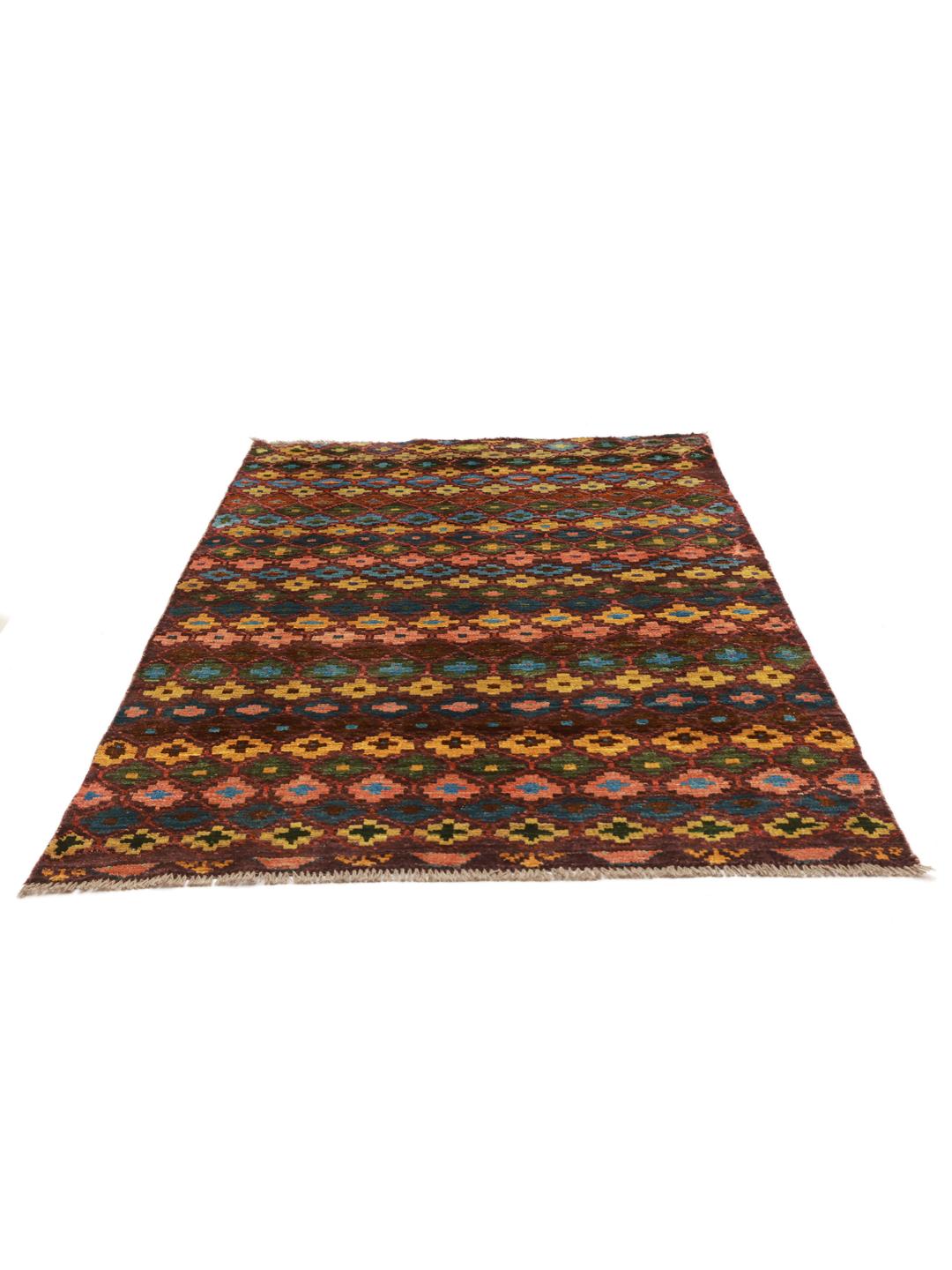 A vibrant, hand-knotted Berber rug from Afghanistan with a geometric multicolored design.