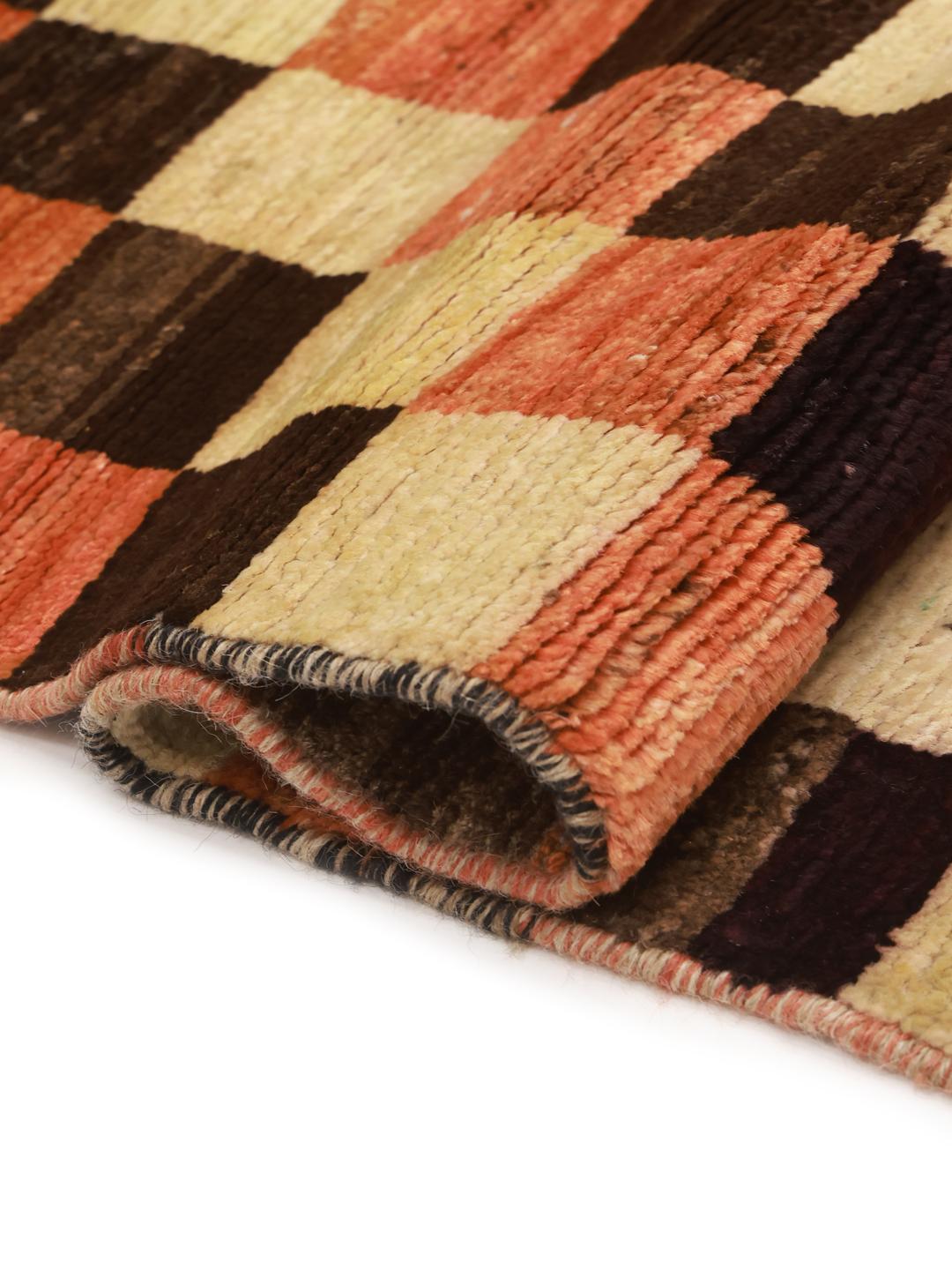 Hand-knotted Berber rug from Afghanistan with a red, black, and beige checkerboard pattern