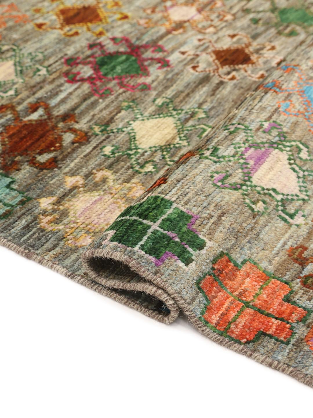Hand-knotted Afghan runner with colourful motifs on a grey background
