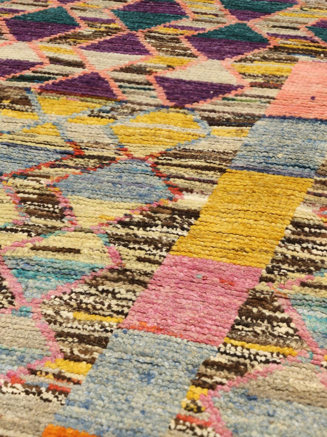 Hand-knotted Afghan rug with vibrant diamond patterns and multicolor design