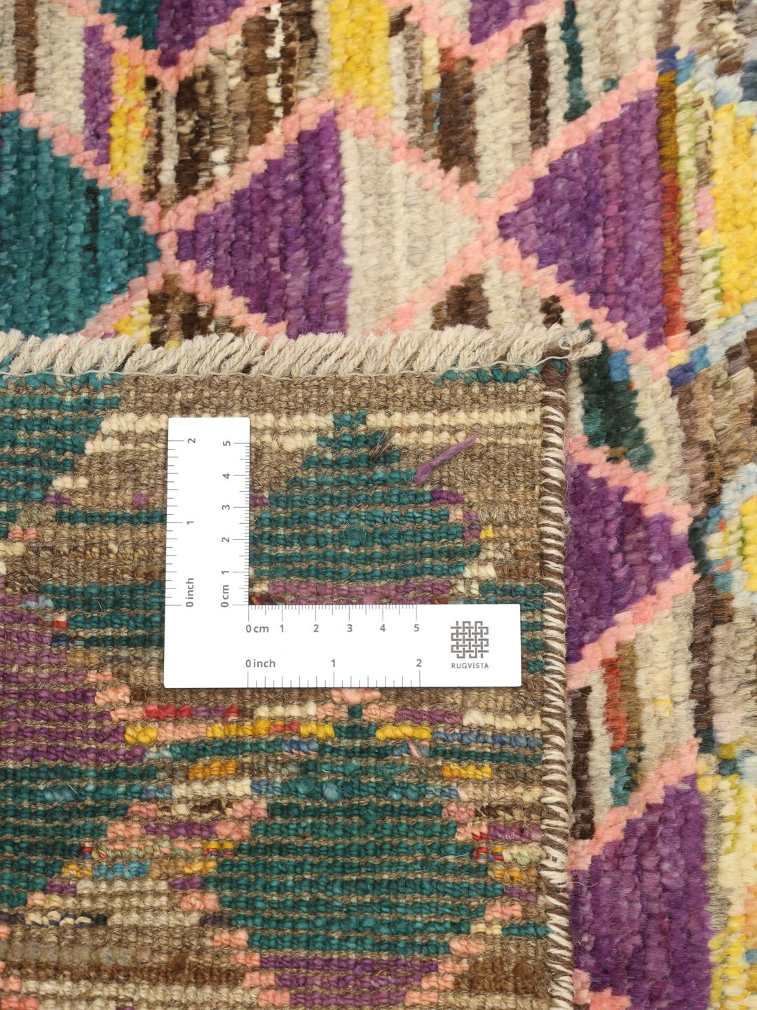 Hand-knotted Afghan rug with vibrant diamond patterns and multicolor design