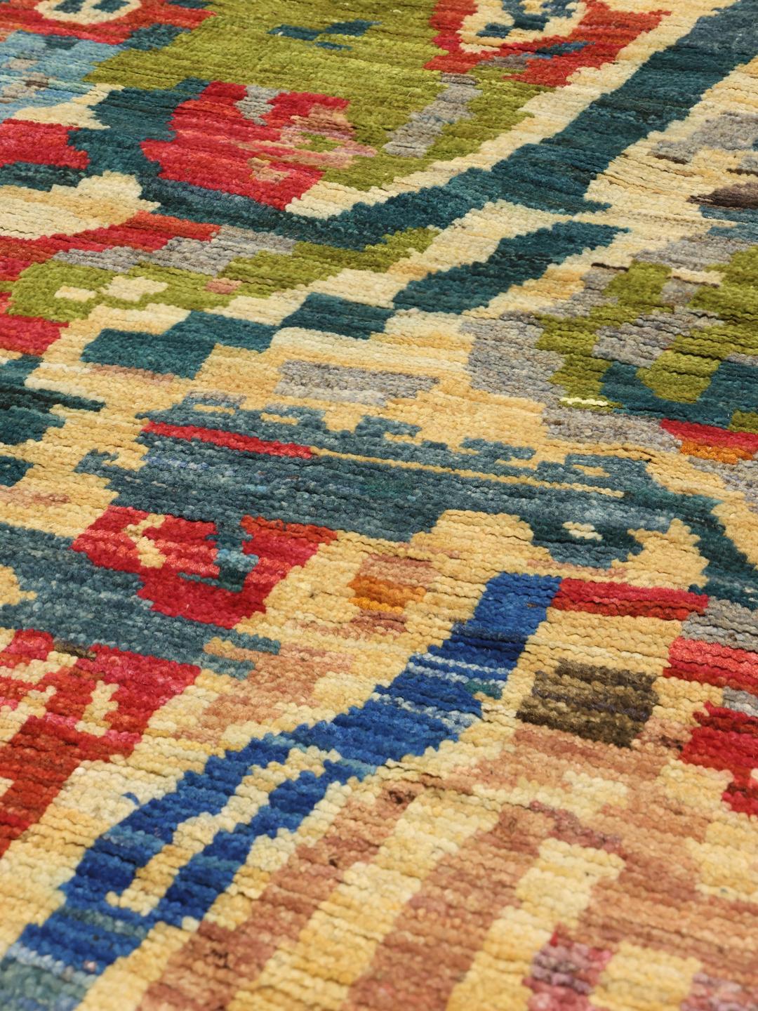 Hand-knotted Afghan rug with vibrant abstract patterns in multicolor