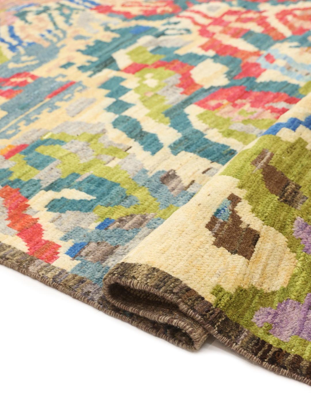 Hand-knotted Afghan rug with vibrant abstract patterns in multicolor