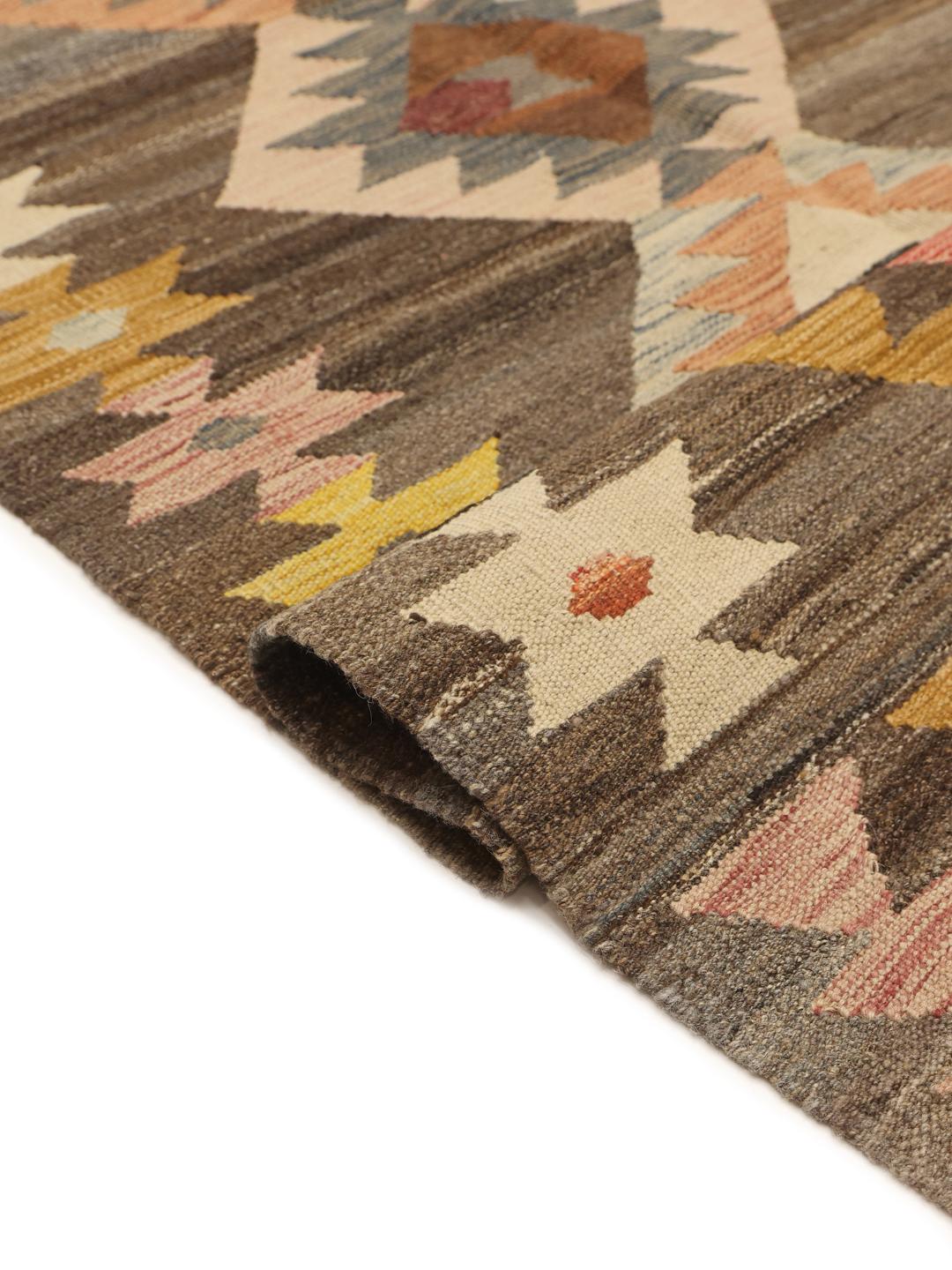 Hand-woven Afghan Kilim rug with geometric diamond patterns in brown, yellow, and blue tones