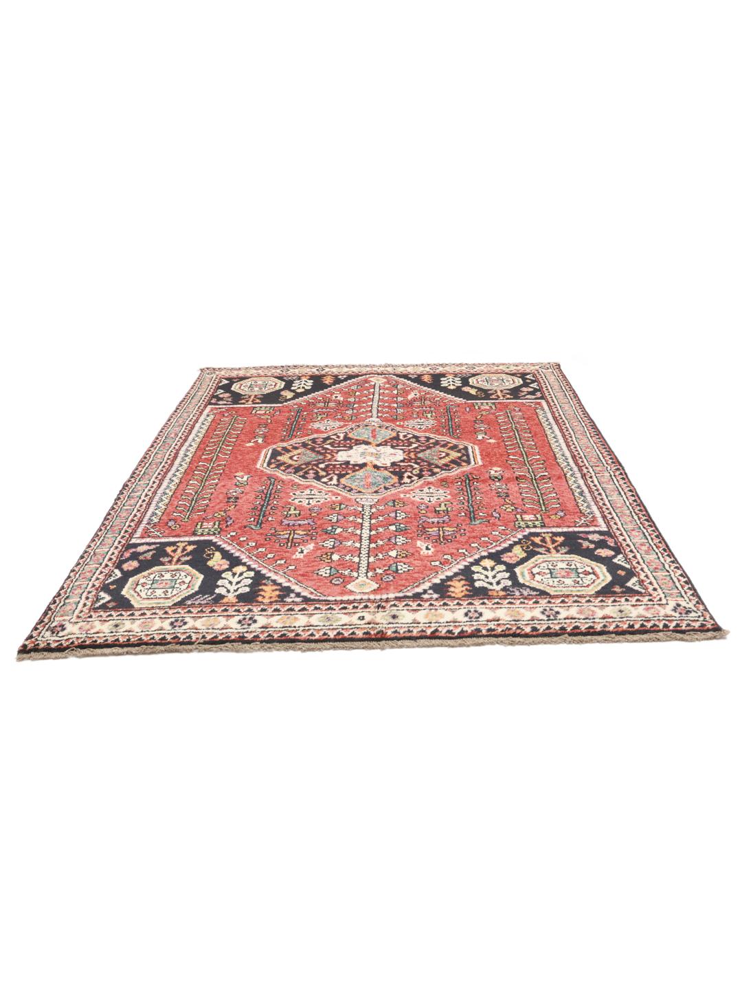 Hand-knotted Kazak rug from Afghanistan featuring red and black geometric patterns.