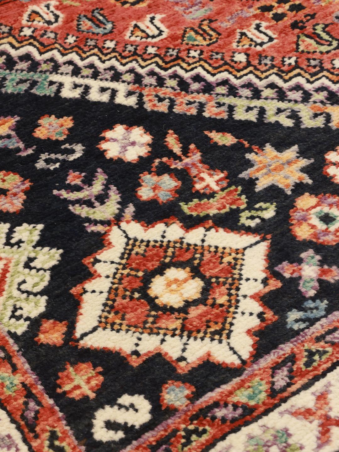 Hand-knotted Afghan Kazak rug in dark-red and black tones with geometric patterns