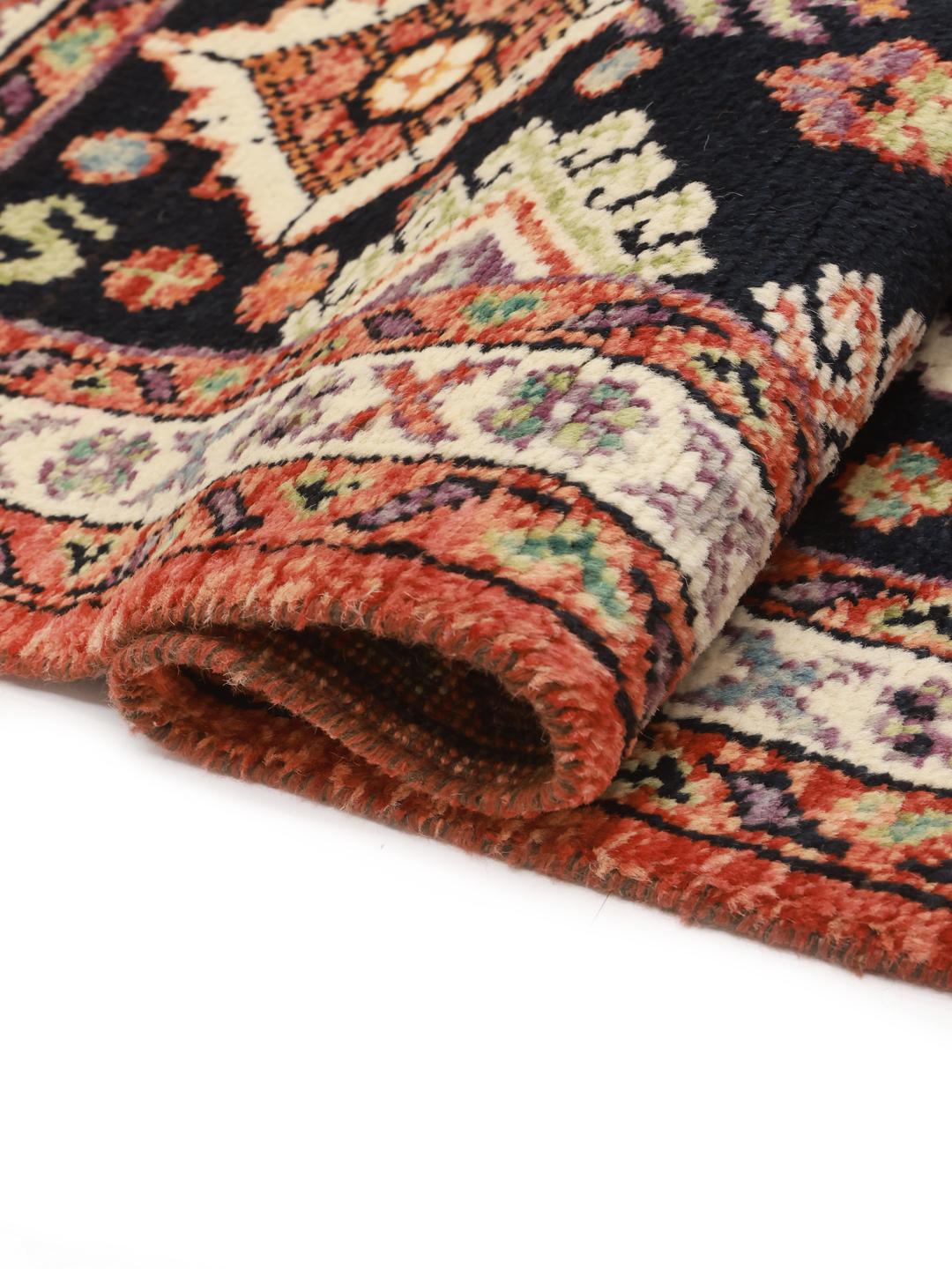 Hand-knotted Afghan Kazak rug in dark-red and black tones with geometric patterns