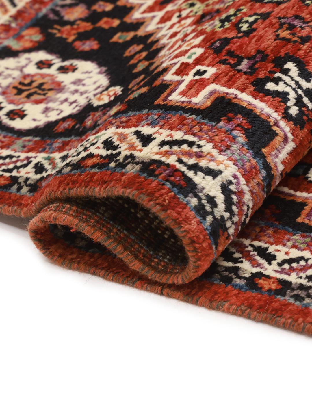 Hand-knotted Kazak rug from Afghanistan in red and black