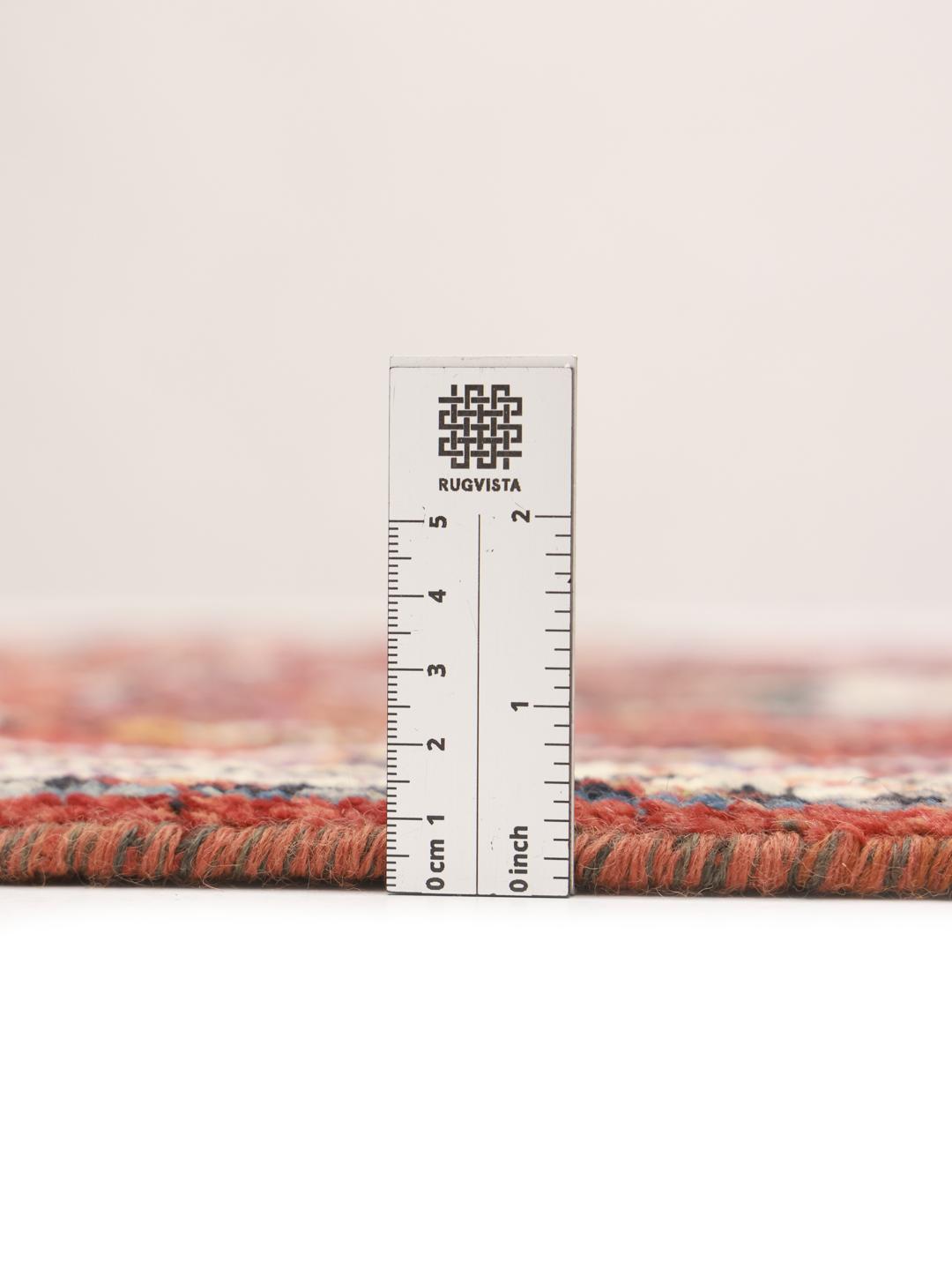 Hand-knotted Kazak rug from Afghanistan in red and black