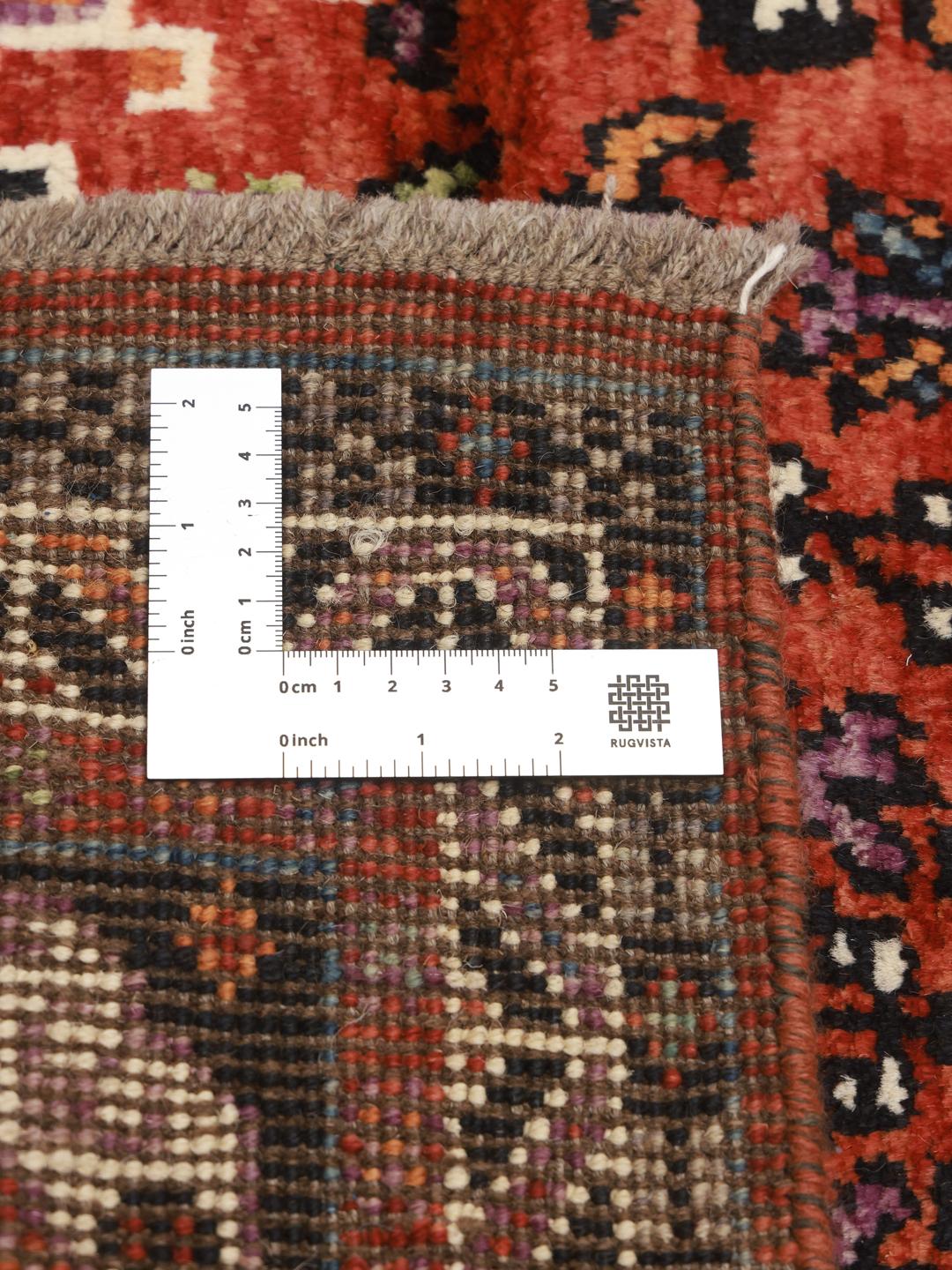 Hand-knotted Kazak rug from Afghanistan in red and black